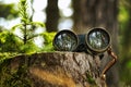 Binoculars lenses reflecting the surrounding trees Royalty Free Stock Photo