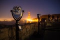 Binoculars looking out at Golden Gate Bridge at night Royalty Free Stock Photo