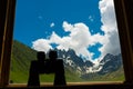 Binoculars lying on sill overlooking mountain. Royalty Free Stock Photo
