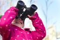 Binoculars, nature and child for explore, discovery and looking on adventure outdoors. Travel, winter and happy, young