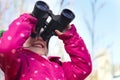 Binoculars, nature and child for explore, discovery and looking on adventure outdoors. Travel, winter and happy, young Royalty Free Stock Photo