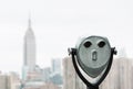 Binoculars and New York City Manhattan skyline Royalty Free Stock Photo