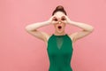 Binoculars sign. Woman looking far far away Royalty Free Stock Photo