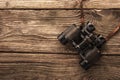 Binoculars on the wooden table Royalty Free Stock Photo