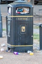 Ely, Cambridgeshire / UK - June 07 2020: Overflowing rubbish bins Royalty Free Stock Photo