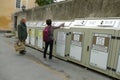 Bins for recycling and garbage collection worker in the city Aosta Italy