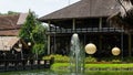 Bintaro, March 2022 - Green water pond with fountain and wooden traditional gazebo outdoor design of Telaga Sampireun Restaurant