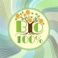 100% bio emblem with tree in blossom on green wavy background, etiquette for natural ecologic products from ecology agriculture