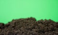 bio ground or soil substrate as frame or border isolated on green background. Place for text, copy space Royalty Free Stock Photo