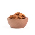 Bio organic almonds in wooden bowl isolated on white background. Royalty Free Stock Photo