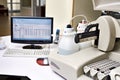Biochemical analyzer and computer in laboratory Royalty Free Stock Photo