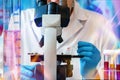 Microscopist working with biological samples in the microscope of the microbiology laboratory Royalty Free Stock Photo