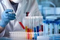 Biochemical engineer working with fluid tubes in the laboratory