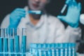 biochemical research scientist working with microscope for coronavirus vaccine development in, Portrait of a Beautiful Female Royalty Free Stock Photo
