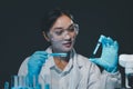 biochemical research scientist working with microscope for coronavirus vaccine development in, Portrait of a Beautiful Female Royalty Free Stock Photo