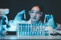 biochemical research scientist working with microscope for coronavirus vaccine development in, Portrait of a Beautiful Female Royalty Free Stock Photo