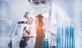 Biochemical research scientist working with a microscope for the virus,Doctor man write a history of the experimental results in a Royalty Free Stock Photo