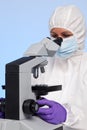Biochemist looking through a microscope Royalty Free Stock Photo
