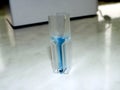 Blue colored solution in the photometry cuvette: glucose level by glucose oxidase method measurement Royalty Free Stock Photo