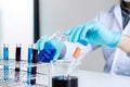 Biochemistry laboratory research, Chemist is analyzing sample in Royalty Free Stock Photo