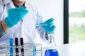 Biochemistry laboratory research, Chemist is analyzing sample in Royalty Free Stock Photo