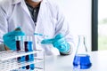 Biochemistry laboratory research, Chemist is analyzing sample in Royalty Free Stock Photo