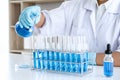 Biochemistry laboratory research, Chemist is analyzing sample in laboratory with equipment and science experiments glassware Royalty Free Stock Photo