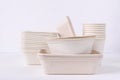 Biodegradable bowl and cup made from natural fiber on white background