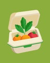 A biodegradable clamshell container holding fresh produce made from plantbased materials and printed with waterbased ink Royalty Free Stock Photo