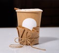 Biodegradable Disposable Cup with blank white circle for text containing a hot drink with copy space. Royalty Free Stock Photo