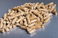 Biofuels. Wood pellets on a silver background.Pellets Biomass -