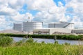 Biogas plant with large biomass digesters along a canal