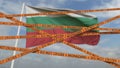 Do not cross biohazard tape lines on the Bulgarian flag background. Restricted entry or quarantine in Bulgaria