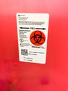 Biohazard sharps needle syringe red container Royalty Free Stock Photo