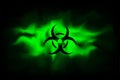 Biohazard sign on a background of infected green fog. Spreading smoke attack biological weapons. Dangerous haze poisoned. Vector