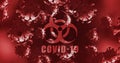 Biohazard symbol and Covid-19 text over multiple Covid-19 cells