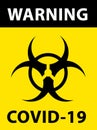 Biohazard symbol on yellow background with the words \