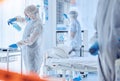 Biohazard team cleaning a medical hospital. Csi team in hazmat suits cleaning a protected quarantined area. Biochemist Royalty Free Stock Photo