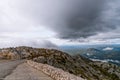 Biokovo. Mountain landscape with low clouds. Warning road sign with exclamation mark and 30 mph speed limit sign. Croatia Royalty Free Stock Photo