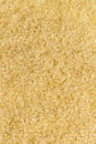 Biological brown rice background, whole uncooked cereal ingredient