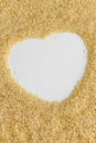 Biological brown rice and heart shape whole uncooked cereal ingredient, space for text Royalty Free Stock Photo