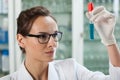 Biologist analyzing test tube with chemical liquid