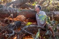 Biologist Environmentalist looking over the damage cause to an Avocado tree