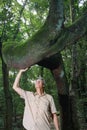 Biologist inspecting the crooked tree trunk of the Anigic Tree Royalty Free Stock Photo