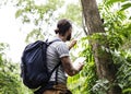 Biologist studying nature in a forest