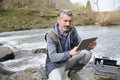 Biologist testing water quality of river Royalty Free Stock Photo