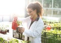 Biologist watering seedlings in greenhouse Royalty Free Stock Photo