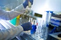 Biologist working in glow box in laboratory