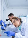 Biologists working on samples in laboratory