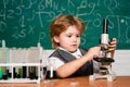 Biology experiments with microscope. September 1. Education. School concept. Preschooler. Little children at school Royalty Free Stock Photo